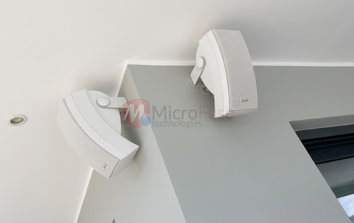 Bose outdoor speakers mounted on wall