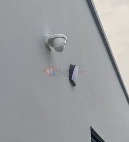 Bullet cameras on new-build exterior