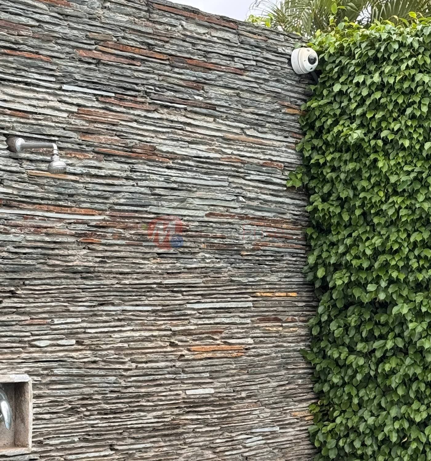 Dome camera on a stone perimeter wall