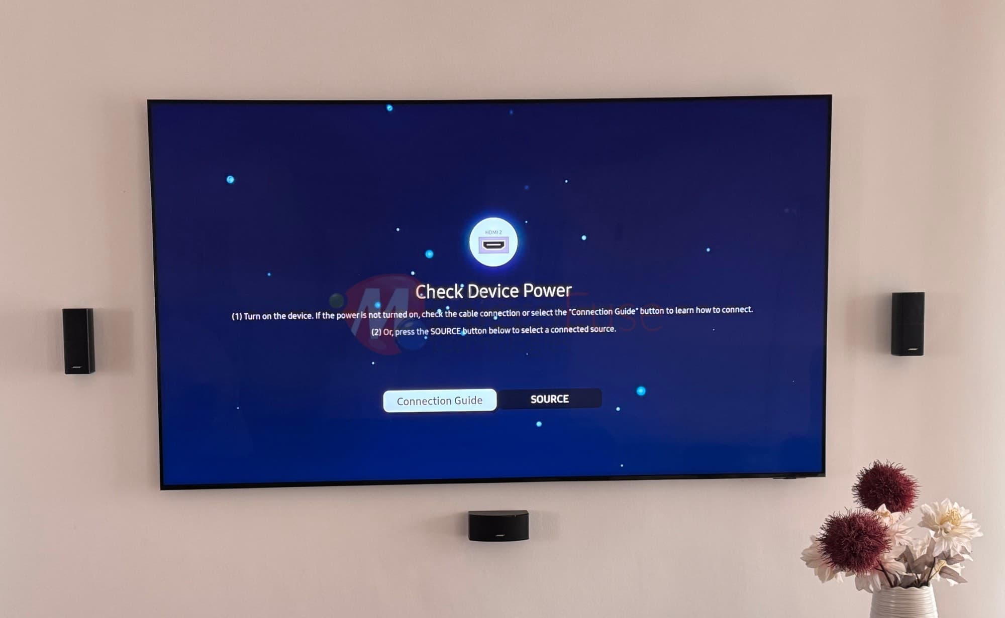 Wall-mounted TV with Bose surround speakers