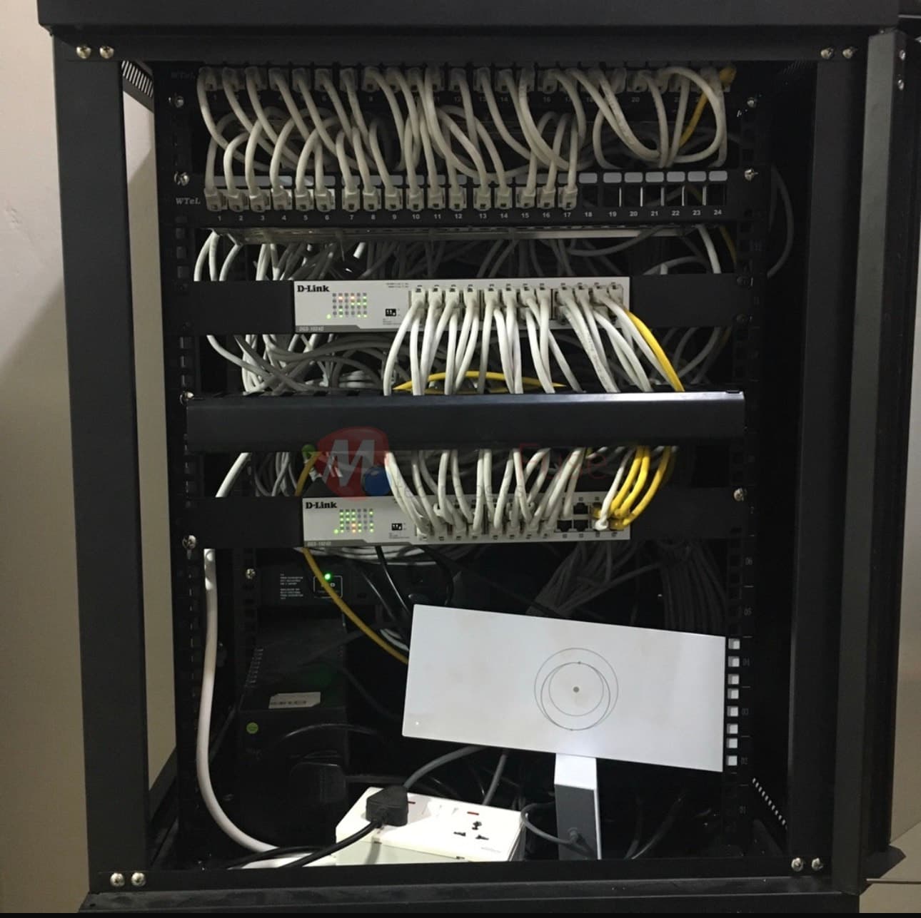 Patch panel and D-Link switches in a network rack